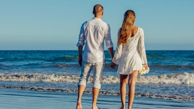 couple on beach romantic setting