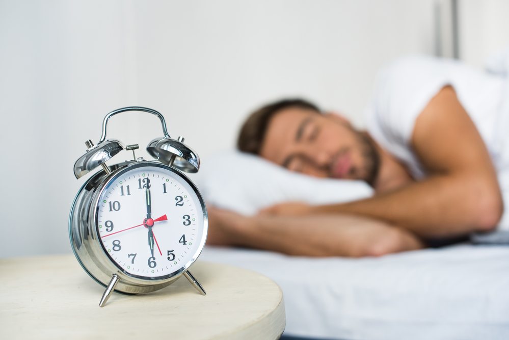 man sleeping next to clock after to do list Guy Counseling