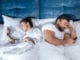smartphones couple in bed